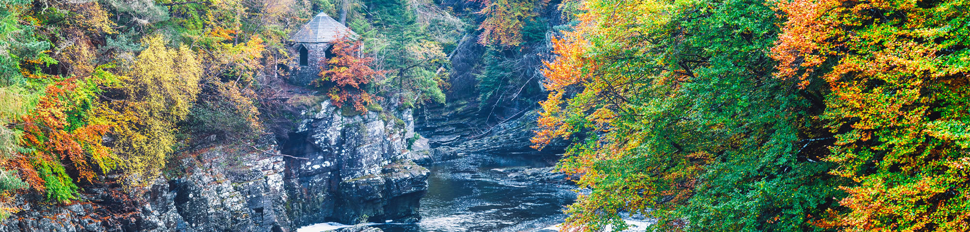 Invermoriston Falls with the Summer House at autumn.