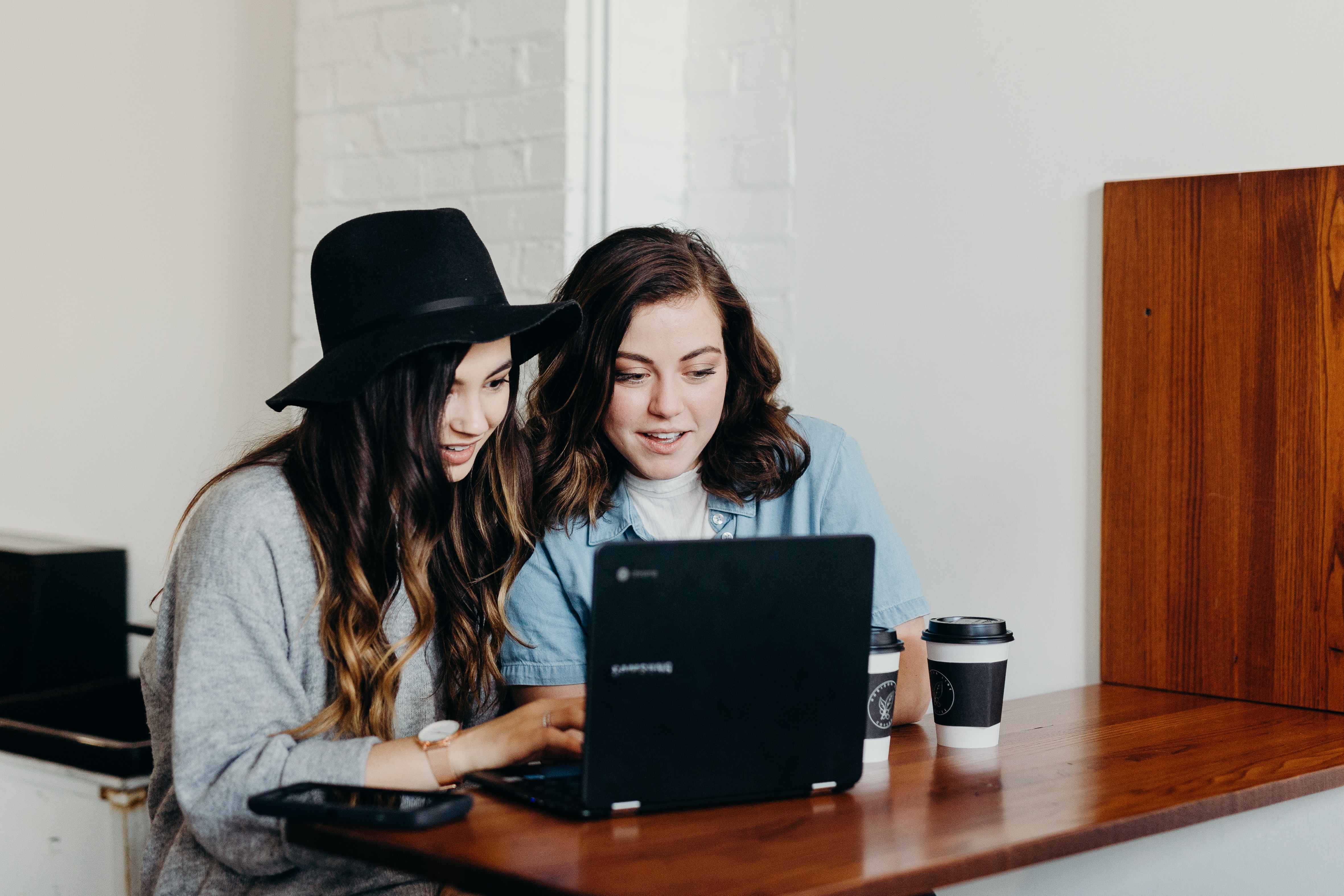 People using laptop, July Newsletter